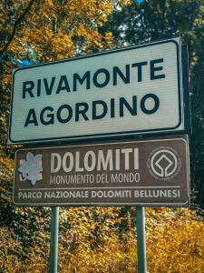 The sign to the entrance of the Rivamonte Agordino in Italy in the Dolomites.