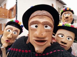 Wooden masks at the Alt de Riva celebrations in Rivamonte Agordino.