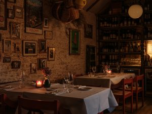 Low candle lit dining room at Da Costa