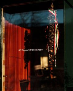 Exterior of Da Costa showing glass door with 'An Italian in Somerset' decals on the door.