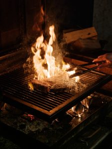 Meat being cooked over fire