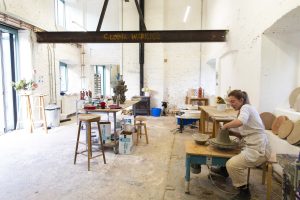 A portrait of ceramicist Elisheva Goldberg in her studio