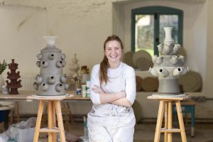 A portrait of ceramicist Elisheva Goldberg in her studio